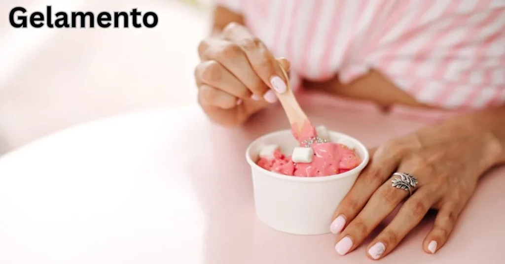 a person holding a spoon over a bowl of ice cream gelamento