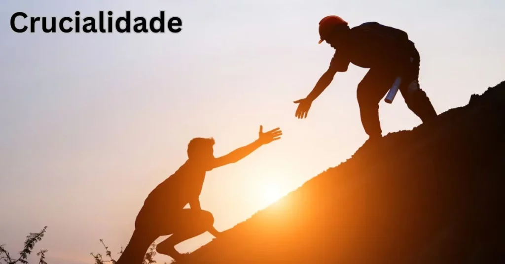 a silhouette of a person helping another person Crucialidade